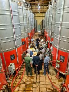 Voyagers enjoy a guided tour of the wine cellars at the Château Val-Joanis