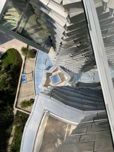 The Luma Building, Arles view looking down from 12th Floor. The building is 56m tall and sits on 'the drum' 54m diameter and 16-18m high. The internal floor area is 15,000 sq m and the outside is covered with 11,000 reflective stainless steel panels