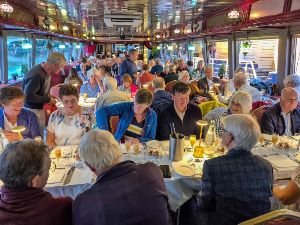 Voyagers enjoy dinner on-board the Le Mireio while cruising the River Rhône. Le Mireio built in 1986 is 50m long with a beam of 7m.