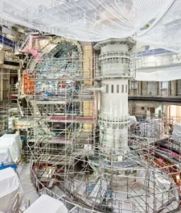 ITER Tokamak Building. View of the reactor being assembled showing on the left the profile of one of the 'D' shaped Toroidal Field Coils. The reactor will have a total of 18 Toroidal Coils each weighing 310 tonnes.