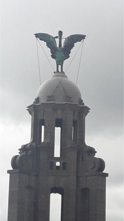 Bertie, the copper Liver Bird on top of the Royal Liver Building clock tower, against a grey sky